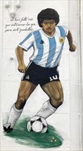 Street art by an unknown artist shows Diego Maradona playing football