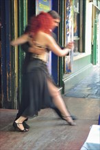 A couple dances tango in public for tourists in La Boca