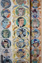 Detail of a mosaic façade with tango musicians