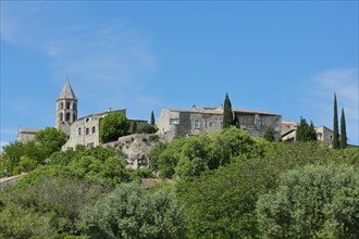 View of mountain village La Garde-Adhémar with St-Michel church