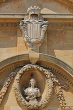 City coat of arms with crown and bust at the Hôtel de Ville