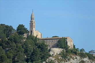 View rocks and mountains with church Notre-Dame de Beauregard