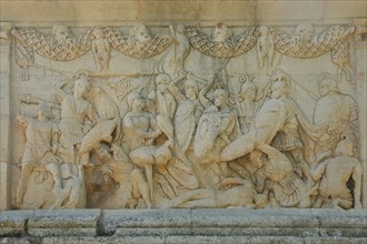 Relief in stone with battle scene