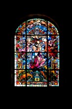 Stained glass window with Our Lady