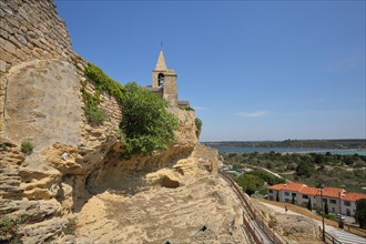 St-Sauveur church on the mountain with rocks