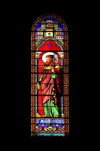 Stained glass window with Matthew of Saint-Dame-du-Bon-Remède Church