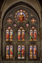 Stained glass window of the neo-Gothic St Baudile Church
