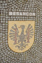 City coat of arms with floor mosaic and inscription