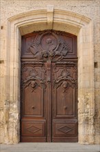 Door with wood carving and decorations at the Musée Archéologique De L'hôtel Dieu