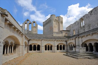 Inner courtyard with cloister and archways of the Romanesque monastery Abbaye de Montmajour