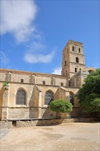 Inner courtyard with church tower of the Romanesque monastery Cloître St-Trophime