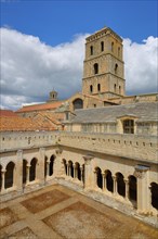 View of church tower and courtyard with cloister