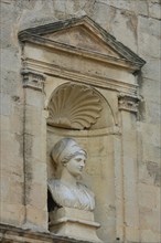 Sculpture and bust at Ste-Anne Church at Place de la République in Arles