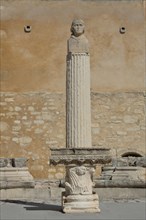 UNESCO Romanesque site with column and bust of former 12th century Pope Clement IV