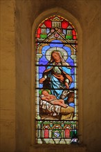 Stained glass window with Our Lady and Child Jesus