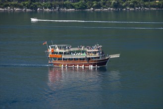 Large excursion boat for tourists on the Bay of Kotor near Perast