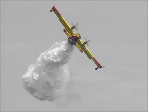 Firefighter plane drops water