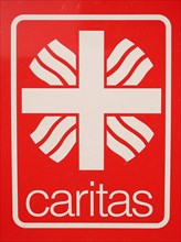 Sign with inscription Caritas