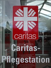 Sign with inscription Caritas Pflegestation