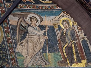 An angel raises his hand as a sign of the Annunciation