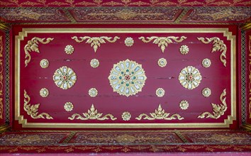 Red ceiling with golden floral ornaments in the Siamese Temple Sala-Thai I