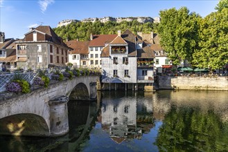 Houses of the old town and the Grand Pont bridge on the river Loue in Ornans