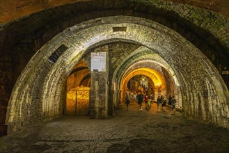 Tourists on a guided tour of the tunnels of the Great Saltworks of Salins-les-Bains