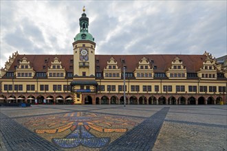 Leipzig market with city coat of arms on the pavement in front of the Old Town Hall