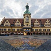 Leipzig market with city coat of arms on the pavement in front of the Old Town Hall