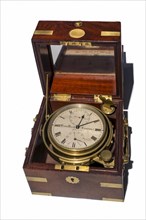 Old marine box chronometer in wooden casing