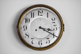 Vintage circular wall clock from the early twentieth century made by Junghans Uhren GmbH