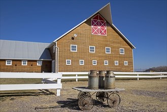 Traditional Mennonite dairy farm with old milk churns