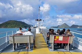Tourists on ferry boat sailing from the island Tortola to Saint Thomas