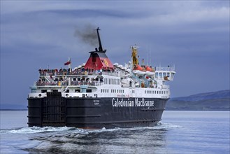 Passengers on deck of the Caledonian MacBrayne ferry boat Isle of Mull
