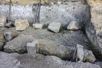 Extraction of block of stone with wooden wedges at the fortified troglodyte town La Roque Saint-Christophe