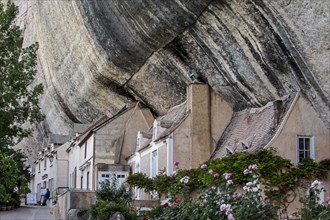 Houses built against cliff face of the Grand Roc at Les Eyzies-de-Tayac-Sireuil