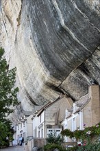Houses built against cliff face of the Grand Roc at Les Eyzies-de-Tayac-Sireuil