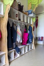 Jackets and shoes at a cloakroom in a kindergarten