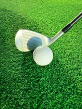 Golf Club with Golf Ball and Shadow on Mat in Switzerland