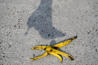 Woman with Shadow from High Heels Shoes Walking on Banana Peel