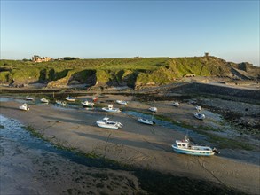 Fishing boats on the ground at low tide in Bude Bay