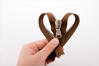 Heart shaped zipper on a white background
