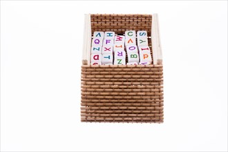 Letter cubes placed in a box on a white background