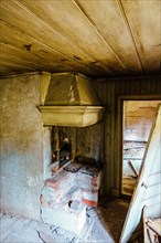 Interior in an old kitchen at a abandoned ruined cottage