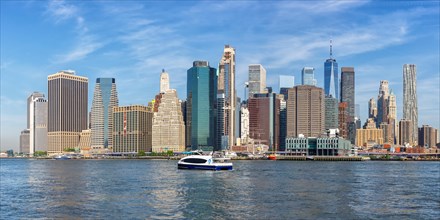 New York City Manhattan skyline with World Trade Center skyscraper and ferry panorama in New York