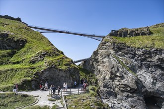 Viewing platform at the cliffs of Tintagel with the old and new footbridge to the castle ruins of Tintagel Castle
