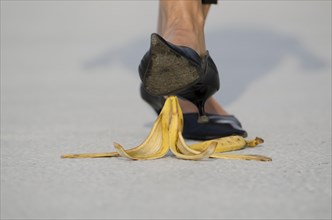 Woman with High Heels Shoes Walking on Banana Peel