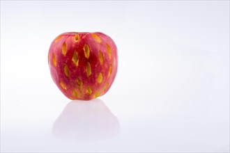 Rotten red apple on a white background
