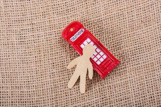 Paper man classical British style Red phone booth of London