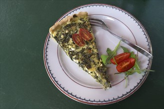 Spinach and feta quiche served in a garden widow